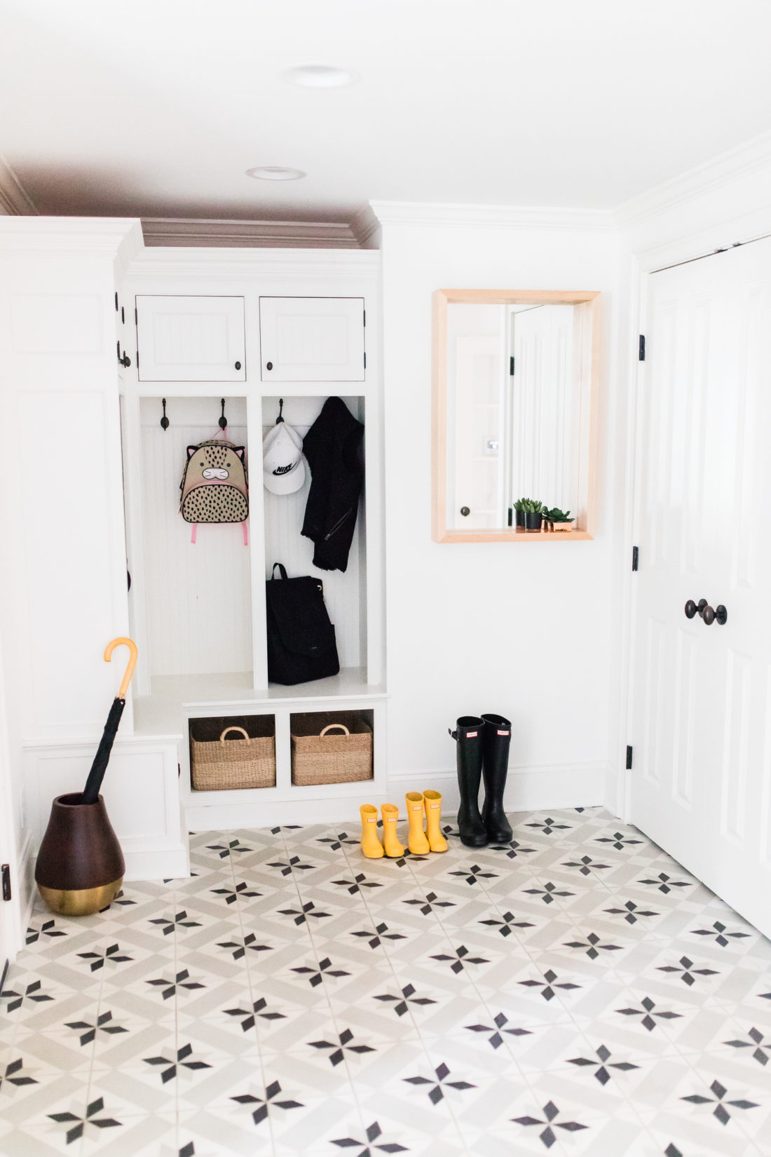 The Black and white mud room in Eva Amurri Martino's Connecticut home featuring black and white patterned cement tile