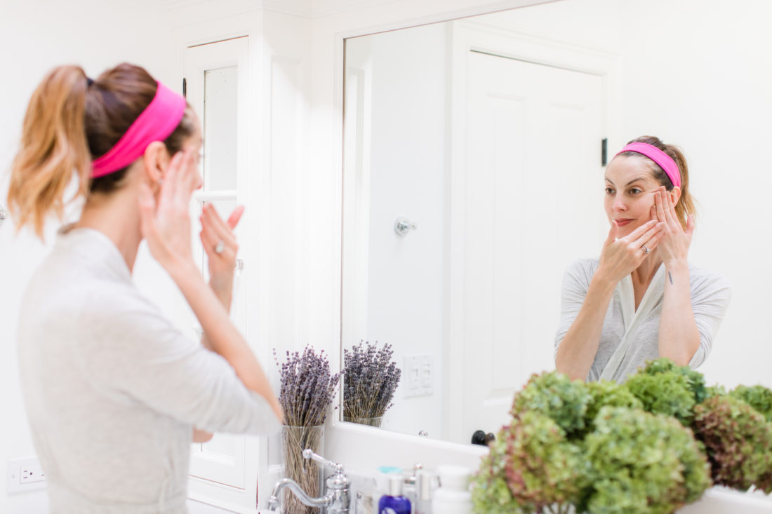 Eva Amurri Martino applies facial moisturizer as part of her night time skincare routine
