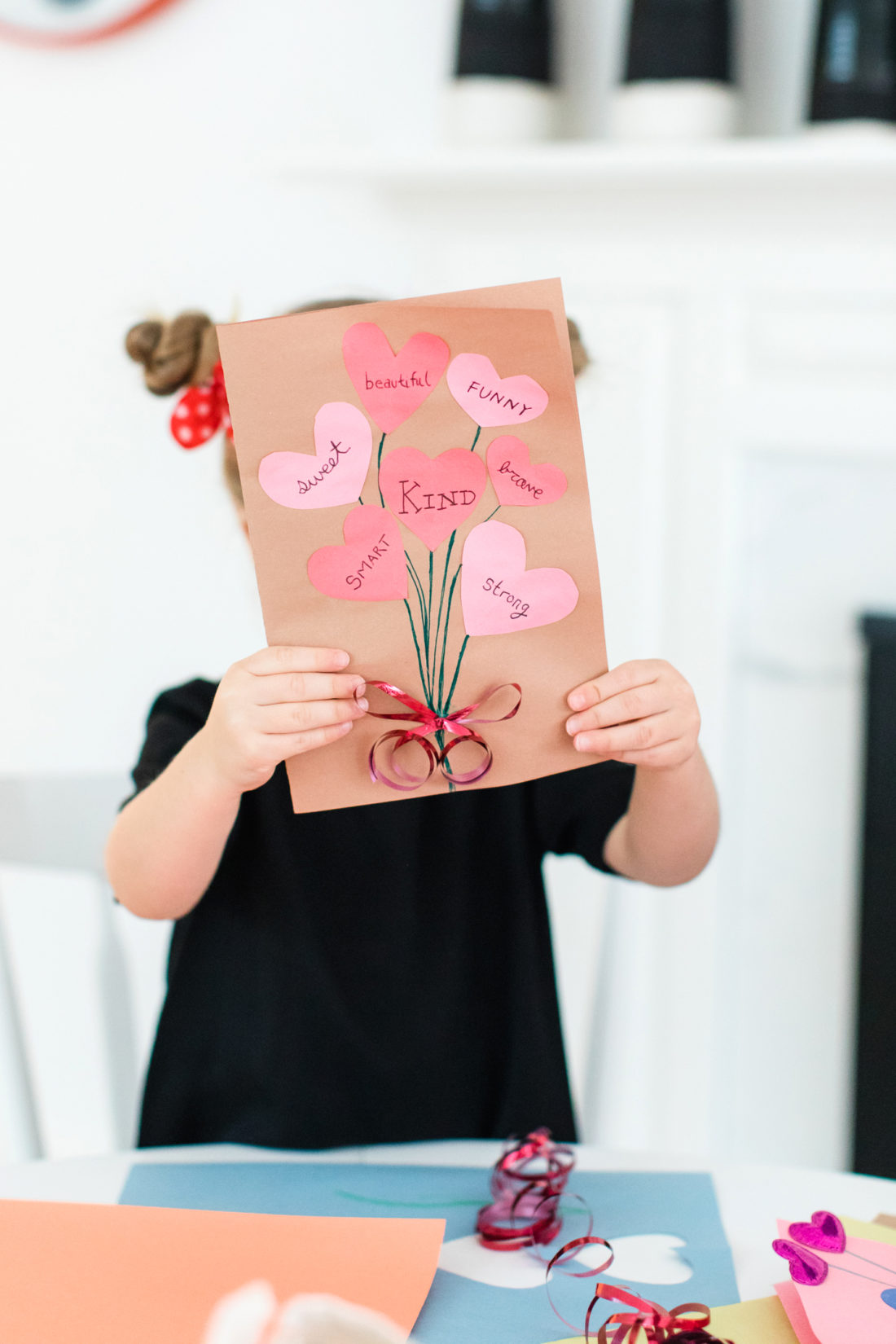 Marlowe Martino shares a homemade Valentine's Day card featuring a cutout heart bouquet on the front