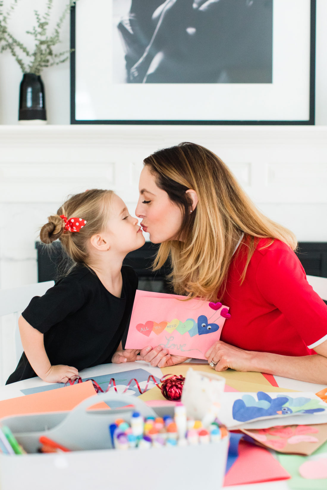 Eva AMurri Martino kisses three year old daughter Marlowe while they make Valentine's Day cards together