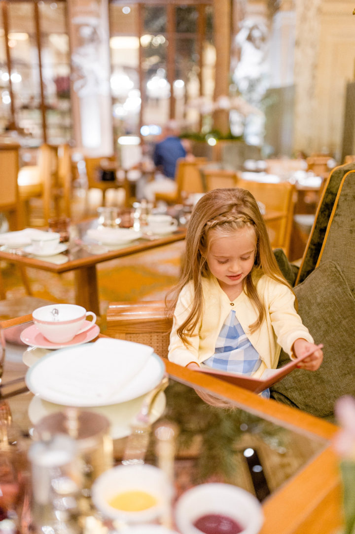 Eva Amurri Martino's daughter Marlowe mulls over the menu at the iconic Plaza Hotel in New York City