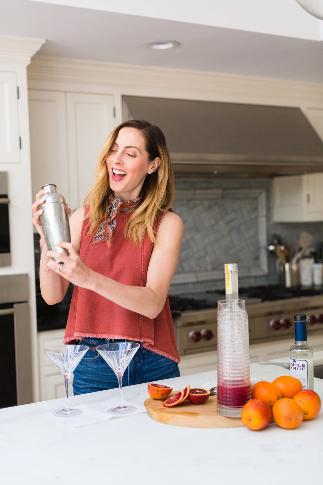 Eva Amurri Martino shakes up her blood orange and ginger martinis in a stainless steel cocktail shaker in the kitchen of her Connecticut home