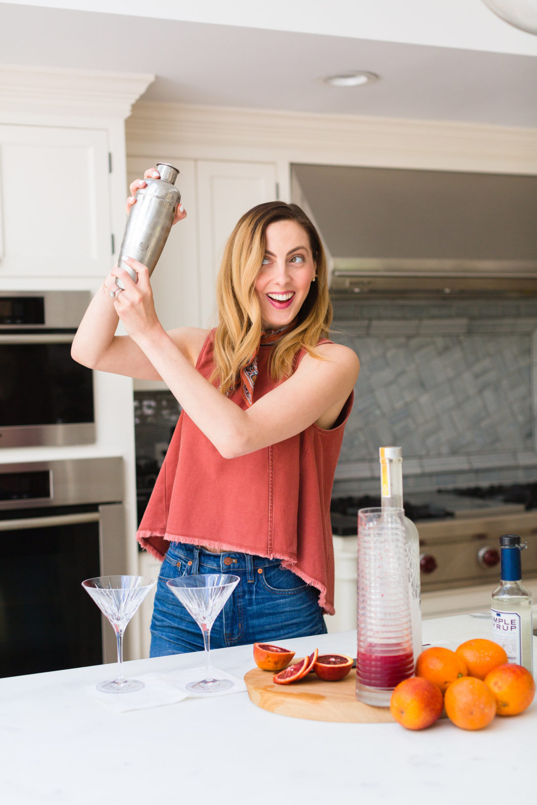 Eva Amurri Martino shakes up her blood orange and ginger martinis in a stainless steel cocktail shaker in the kitchen of her Connecticut home