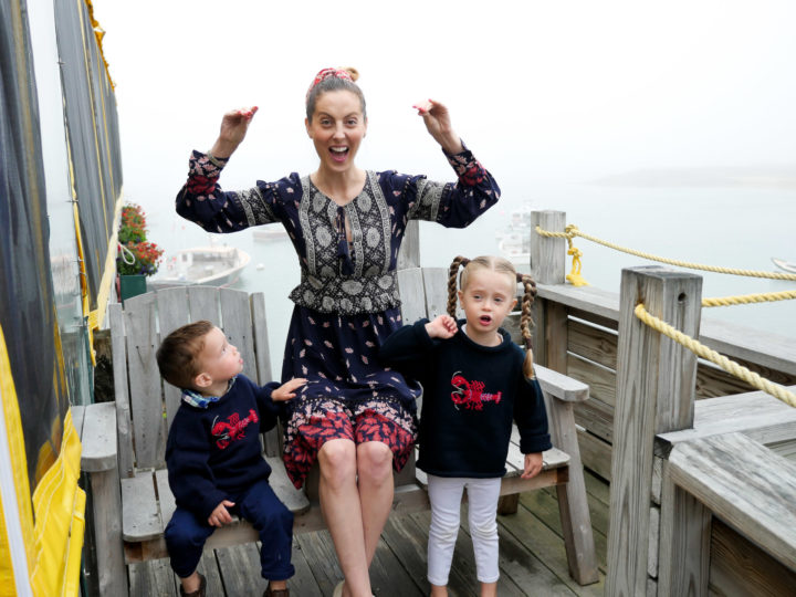 Eva Amurri Martino waves her hands like she just don't care, while her kids Marlowe and Major look on in matching lobster sweaters.