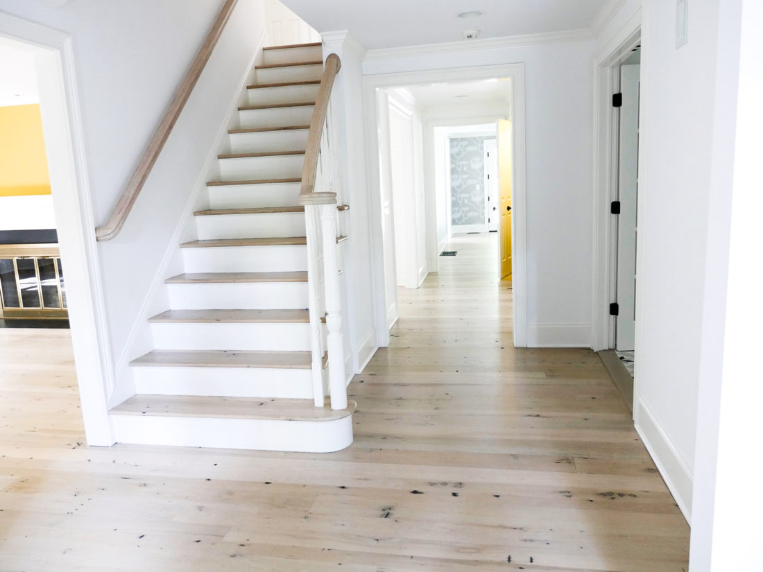 Freshly renovated home in Connecticut with light wood floors and white walls