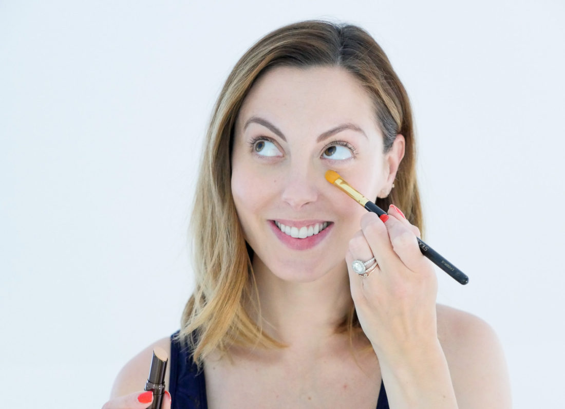 Eva Amurri Martino of Happily Eva After blog applying Hourglass concealer with a concealer brush