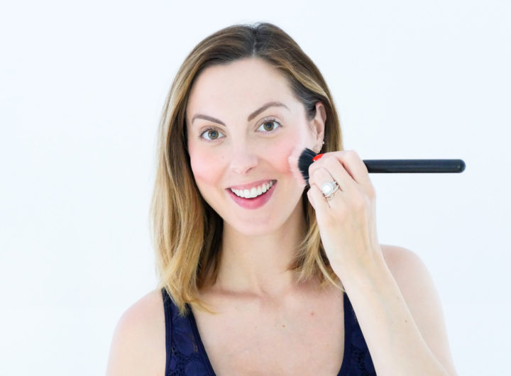 Eva Amurri Martino of Happily Eva After blog applies chantecaille cream blush to her cheeks and blends with a brush as part of her September Beauty Picks