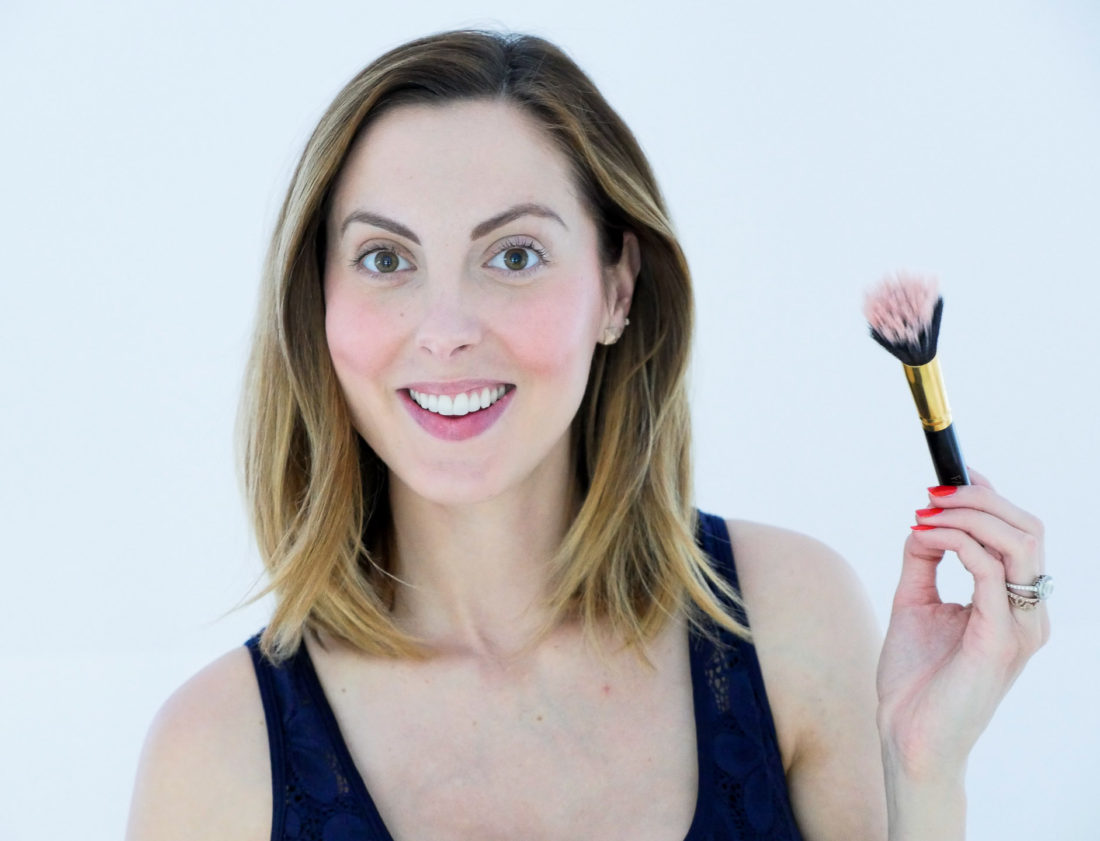 Eva Amurri Martino of Happily Eva After blog applies chantecaille cream blush to her cheeks and blends with a brush as part of her September Beauty Picks