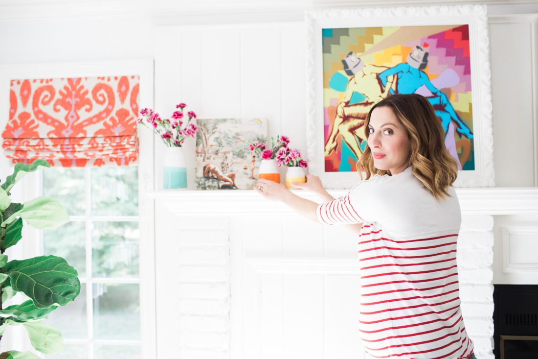 Eva Amurri Martino of lifestyle blog Happily Eva After styling the multicolored mantlepiece in her family room
