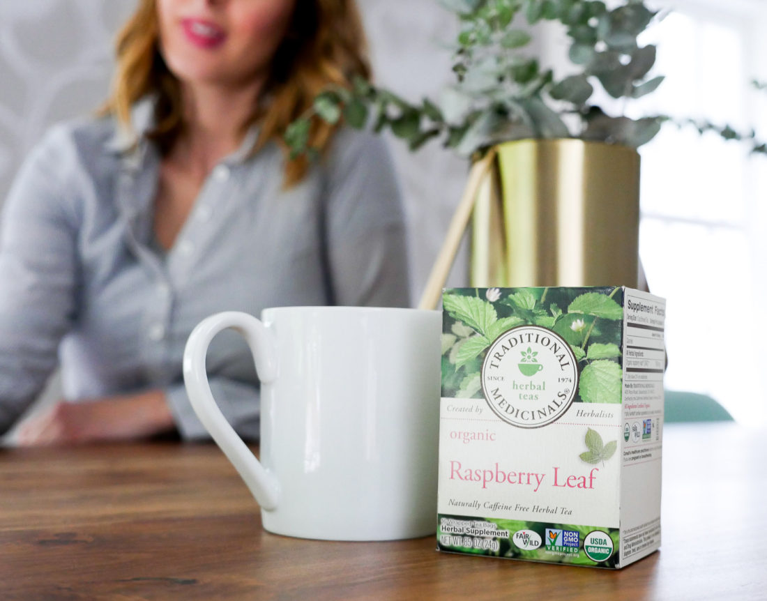 Eva Amurri Martino of lifestyle blog Happily Eva After, shows off her use of traditional medicinals teas during pregnancy in her dining room, featuring raspberry leaf tea