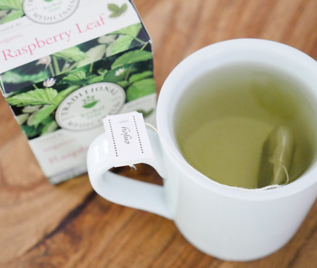 Eva Amurri Martino of lifestyle blog Happily Eva After, shows off her use of traditional medicinals teas during pregnancy in her dining room, featuring raspberry leaf tea