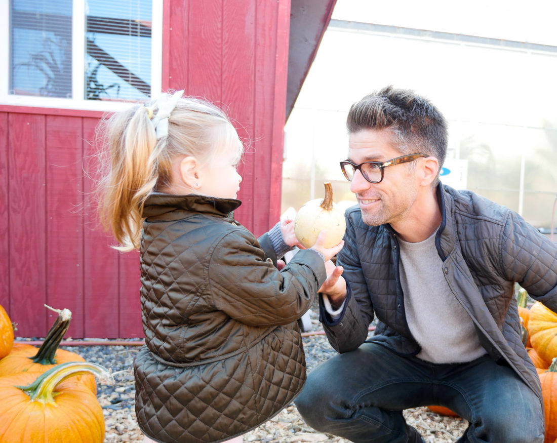 Kyle Martino picking out pumpkins with two year old daughter Marlowe at silverman's pumpkin patch in connecticut