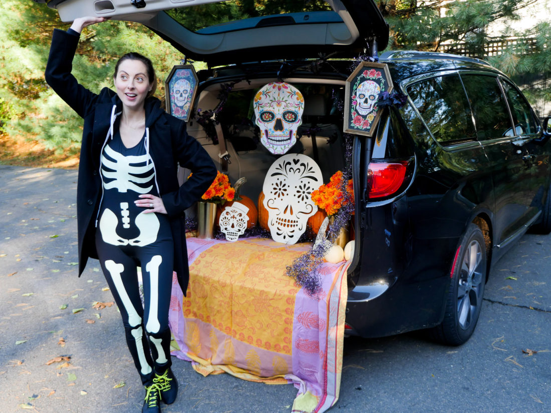 Eva Amurri Martino decorating her trunk with a Day Of The Dead theme for her daughter's Preschool's Trunk-or-Treat party
