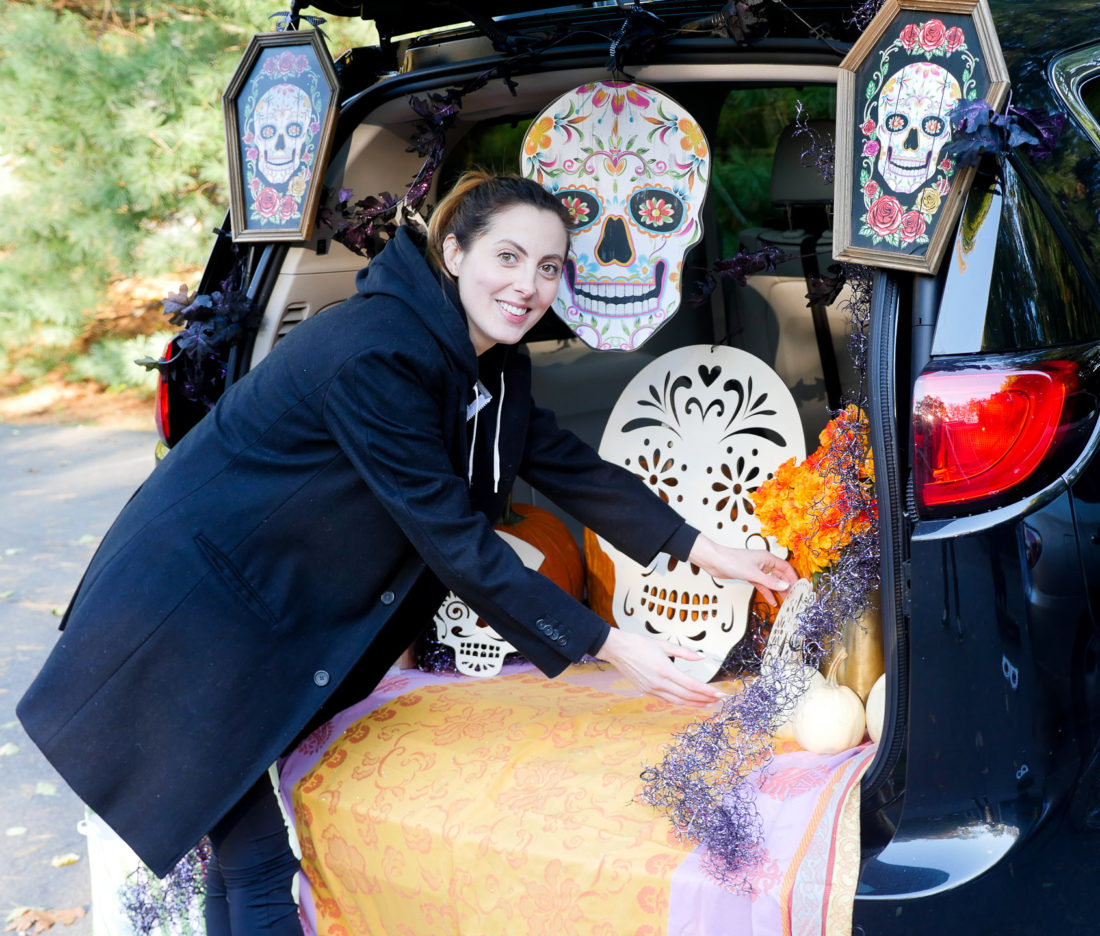 Eva Amurri Martino decorating her trunk with a Day Of The Dead theme for her daughter's Preschool's Trunk-or-Treat party