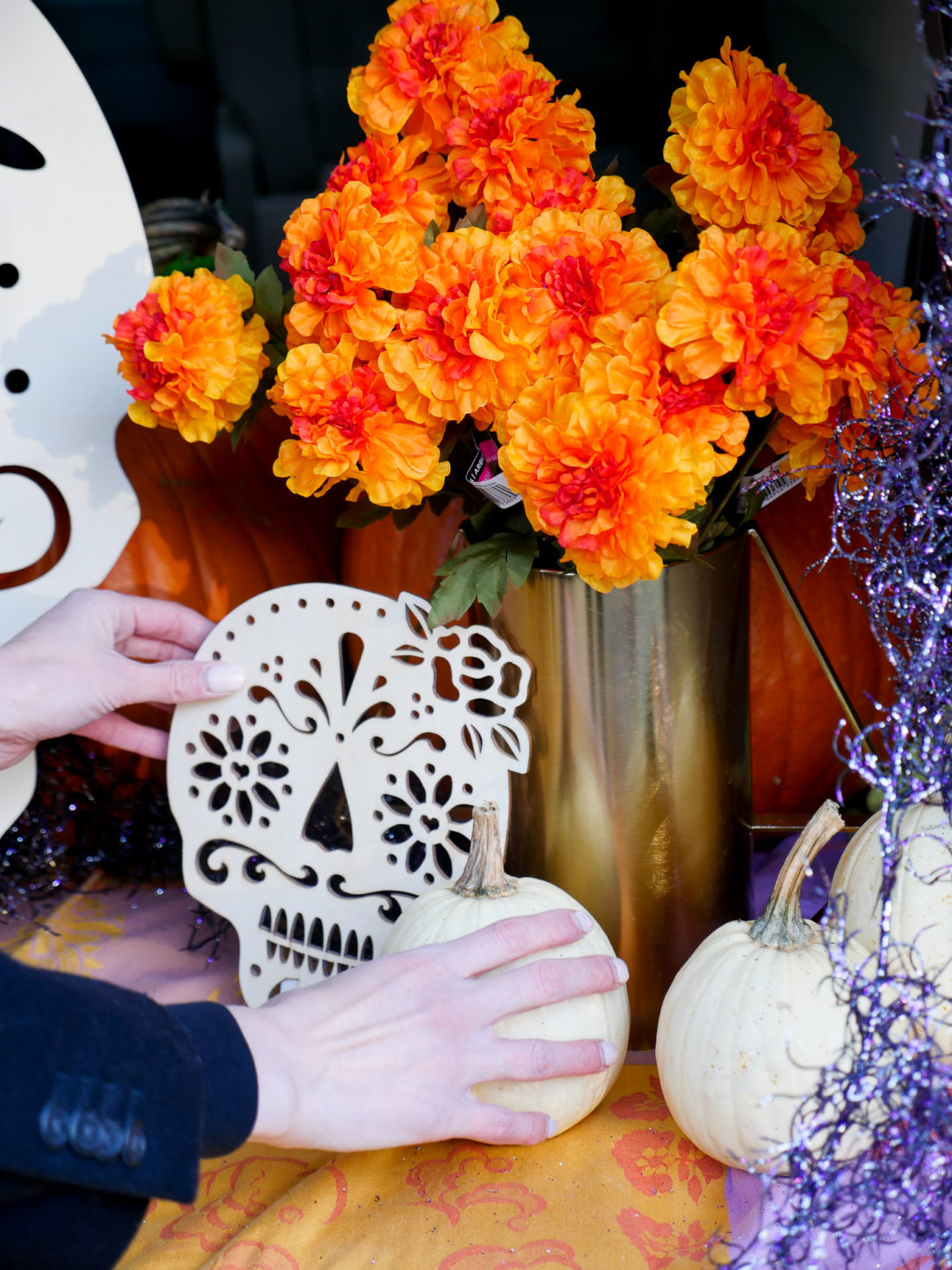 Eva Amurri Martino decorating her trunk with a Day Of The Dead theme for her daughter's Preschool's Trunk-or-Treat party