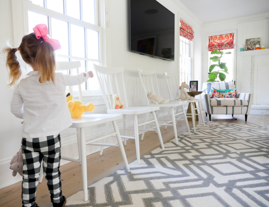 Marlowe Martino placing stuffed animals on chairs at her brother's Sip And See