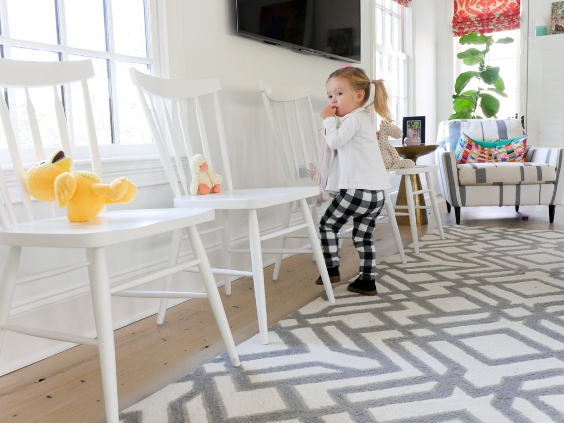 Marlowe Martino placing stuffed animals on chairs at her little brother's Sip And See