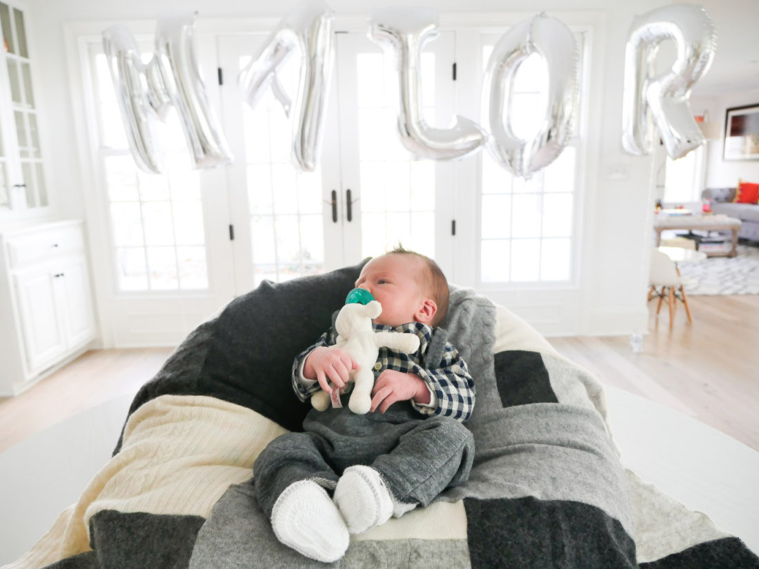 Lifestyle and Motherhood blogger Eva Amurri Martino's newborn son, Major James, is pictured in the foreground with a balloon sign spelling out his name at the Sip And See party in his honor at her connecticut home