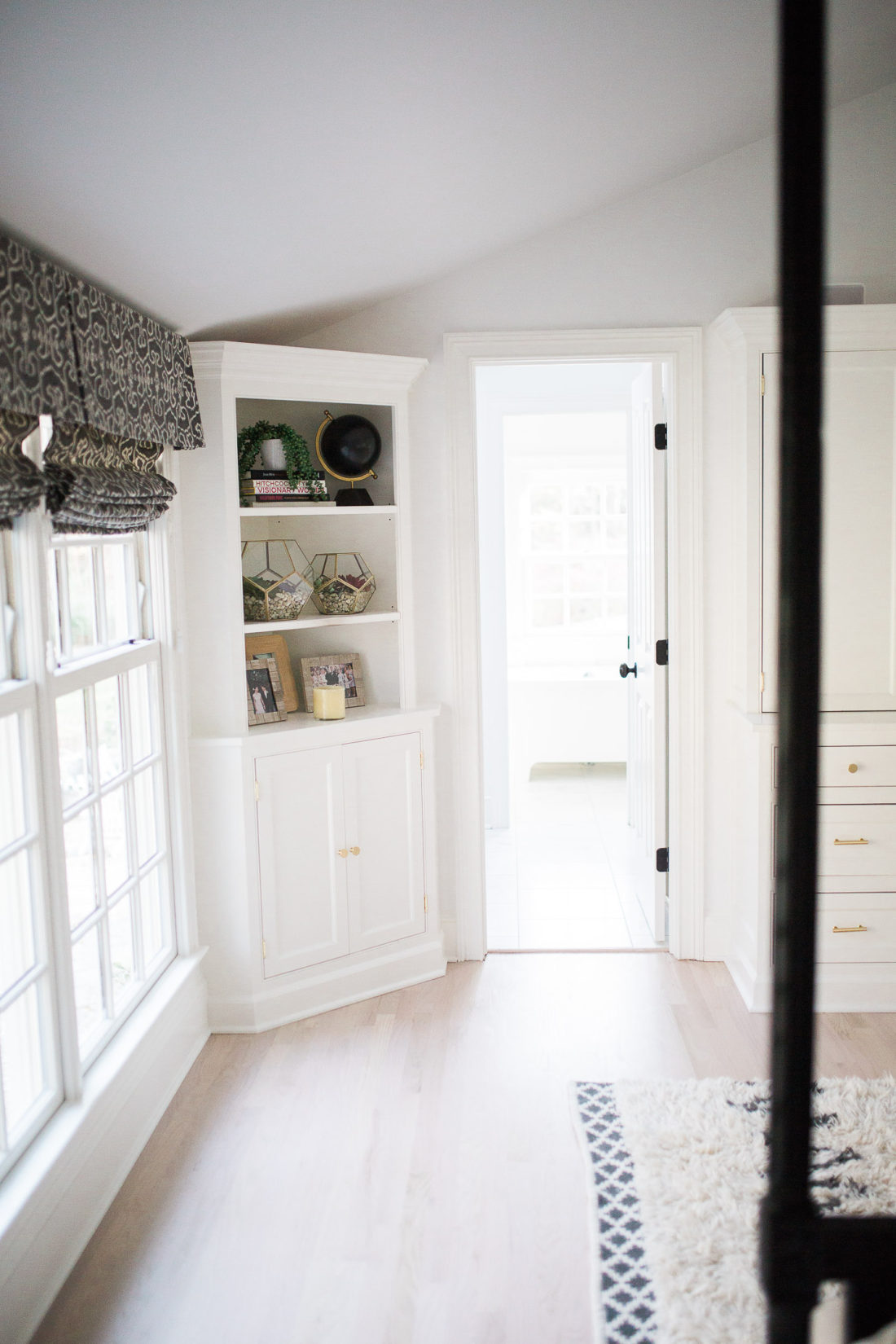 A close up of the shelves in Eva Amurri Martino's black, white, and linen Master Bedroom at her home in Connecticut