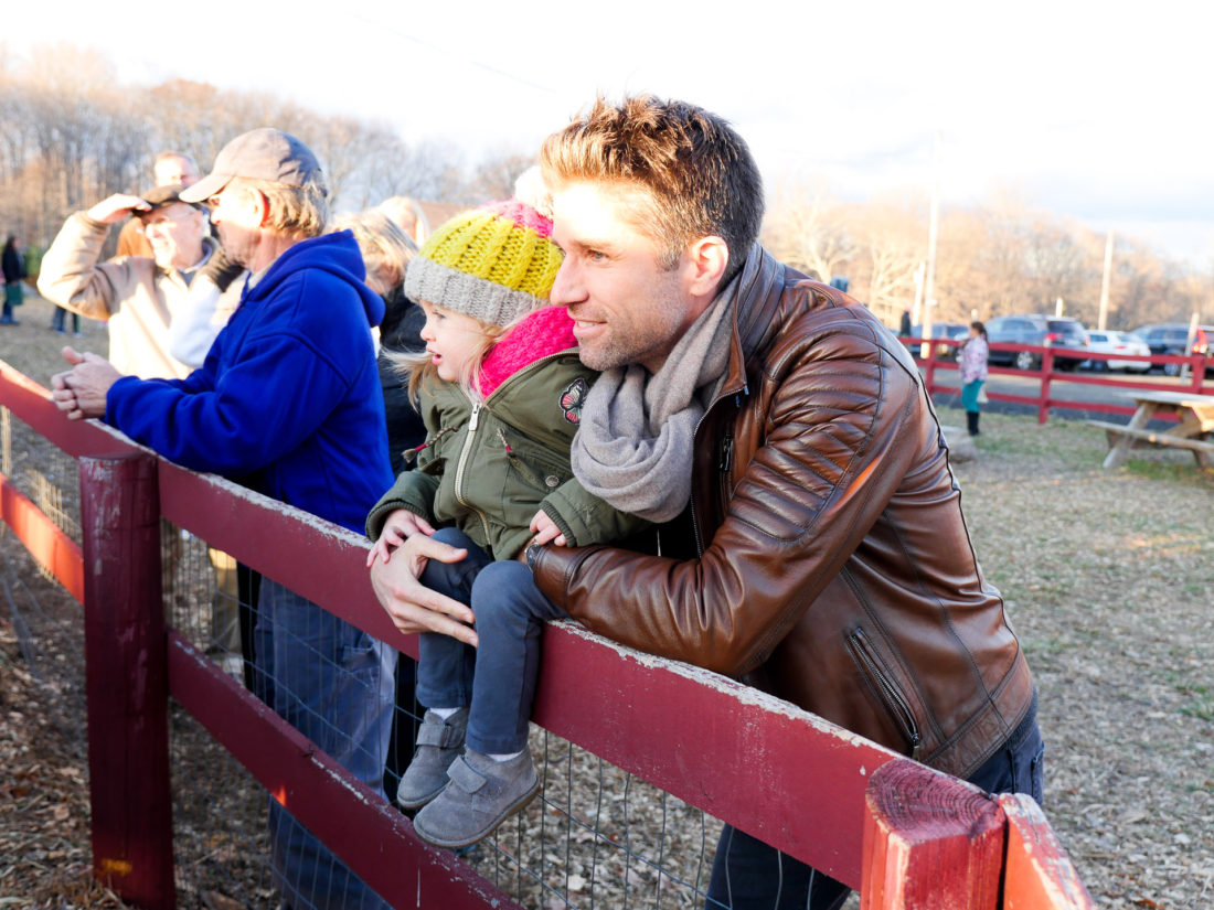 Kyle and Marlowe martino visit with the cows at Maple Row Farm in Connecticut