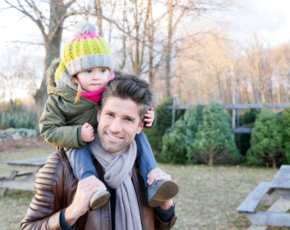 Marlowe Martino sits on dad Kyle Martino's shoulders at the Christmas tree farm in Connecticut