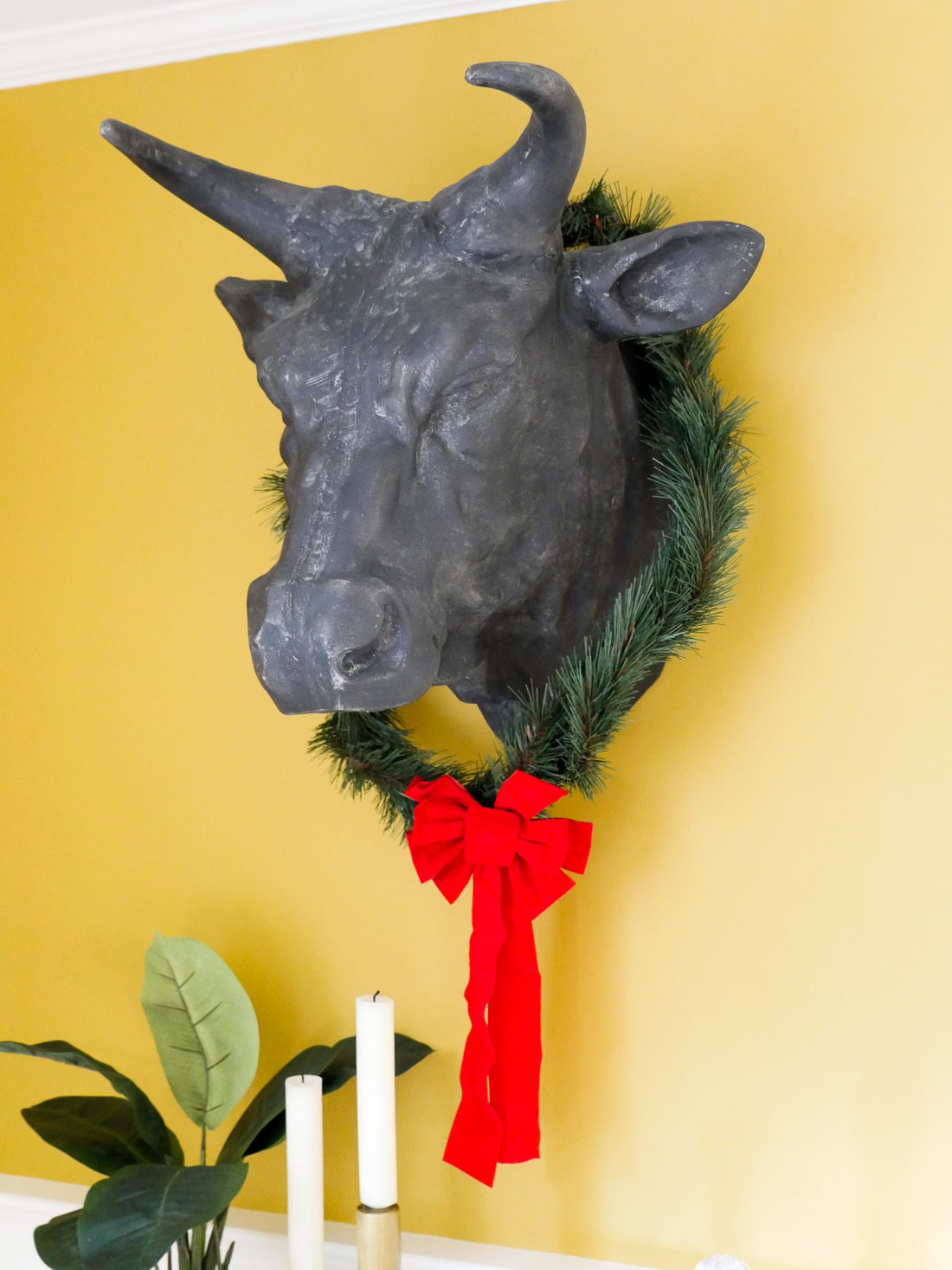 An iron bull's head decorated for Christmas
