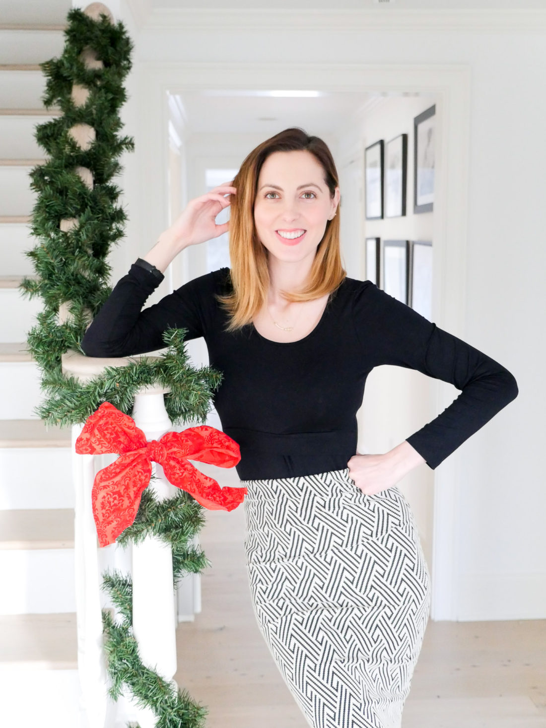 Eva Amurri Martino standing in the foyer of her new Connecticut home at Christmas time