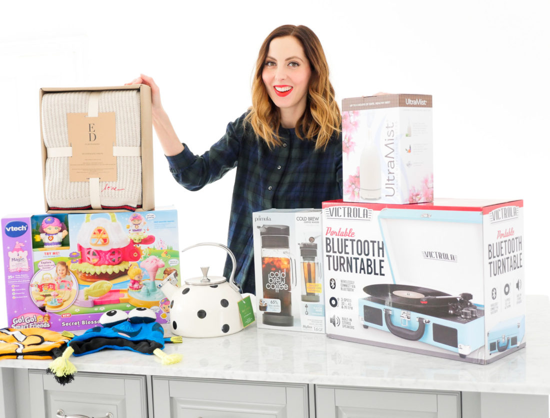 Eva Amurri Martino poses with an array of holiday gifts for friends and family