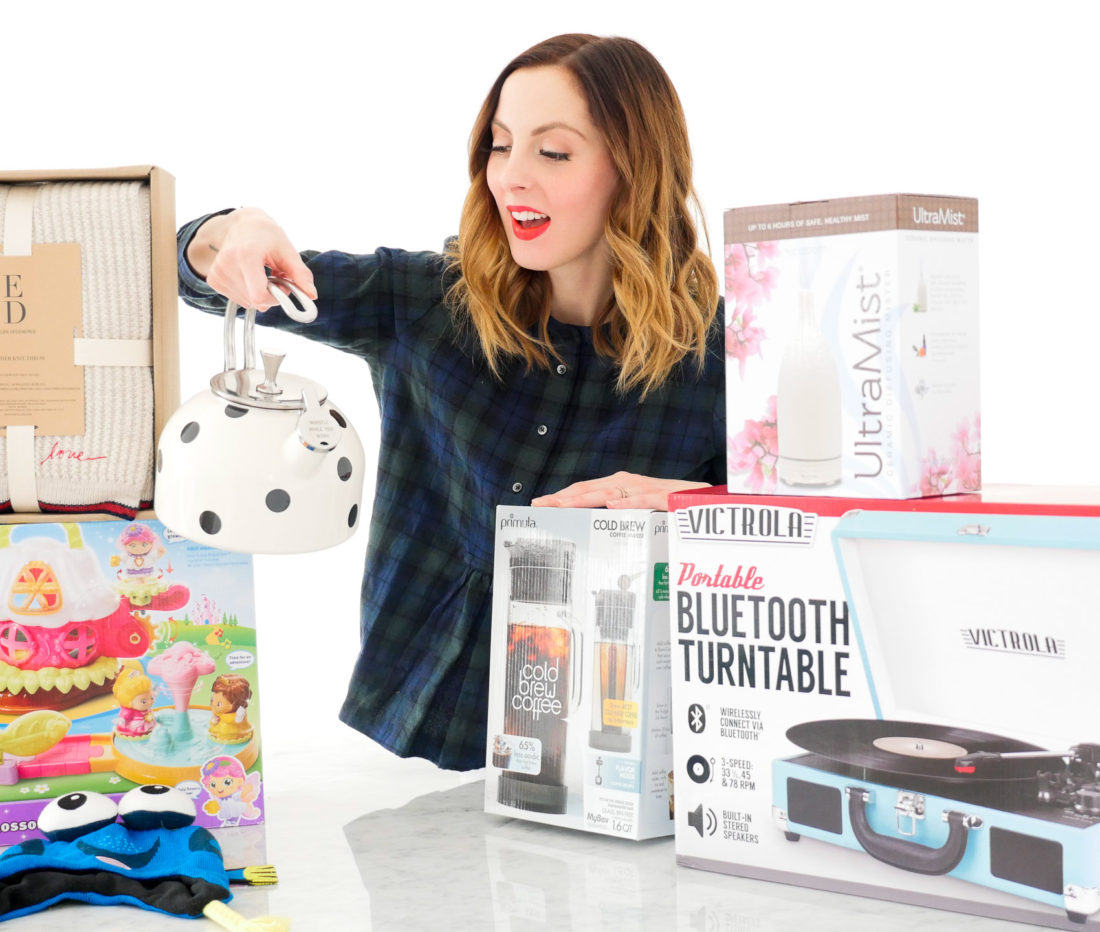 Eva Amurri Martino poses with an array of holiday gifts for friends and family