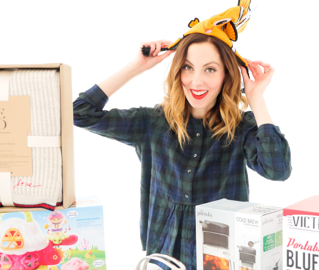 Eva Amurri Martino poses with an array of holiday gifts for friends and family