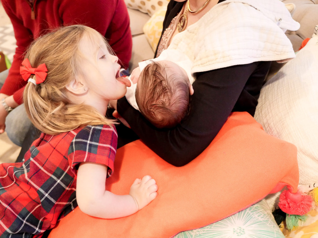 Marlowe martino licking her baby brother's head