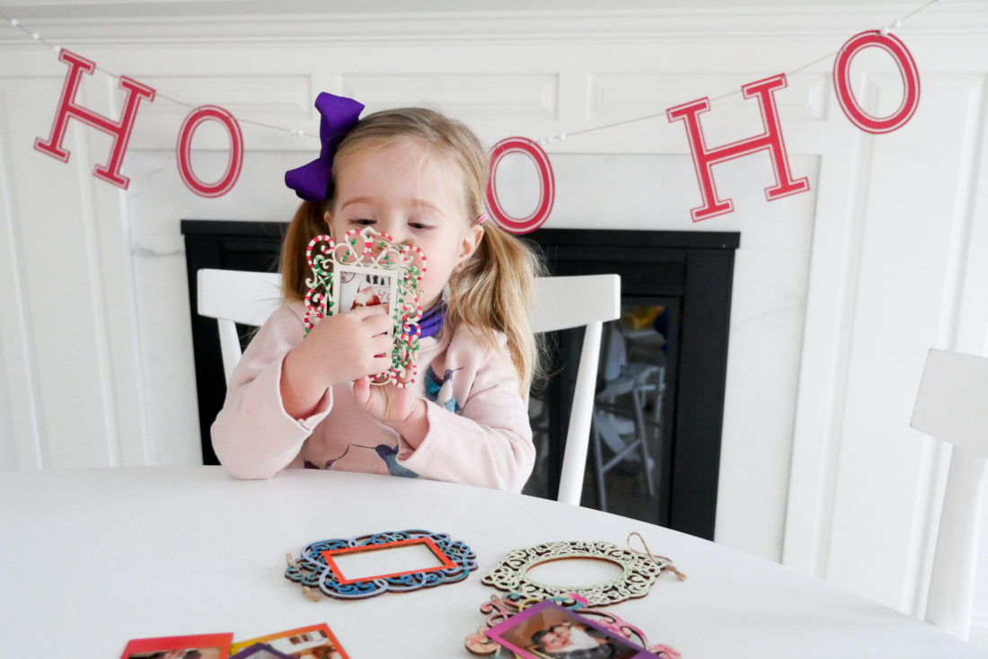 Eva Amurri Martino and two year old daughter Marloweuse plain wooden frames and craft paint to create holiday photo ornaments using the FUJIFILM Instax Mini 70 instant camera