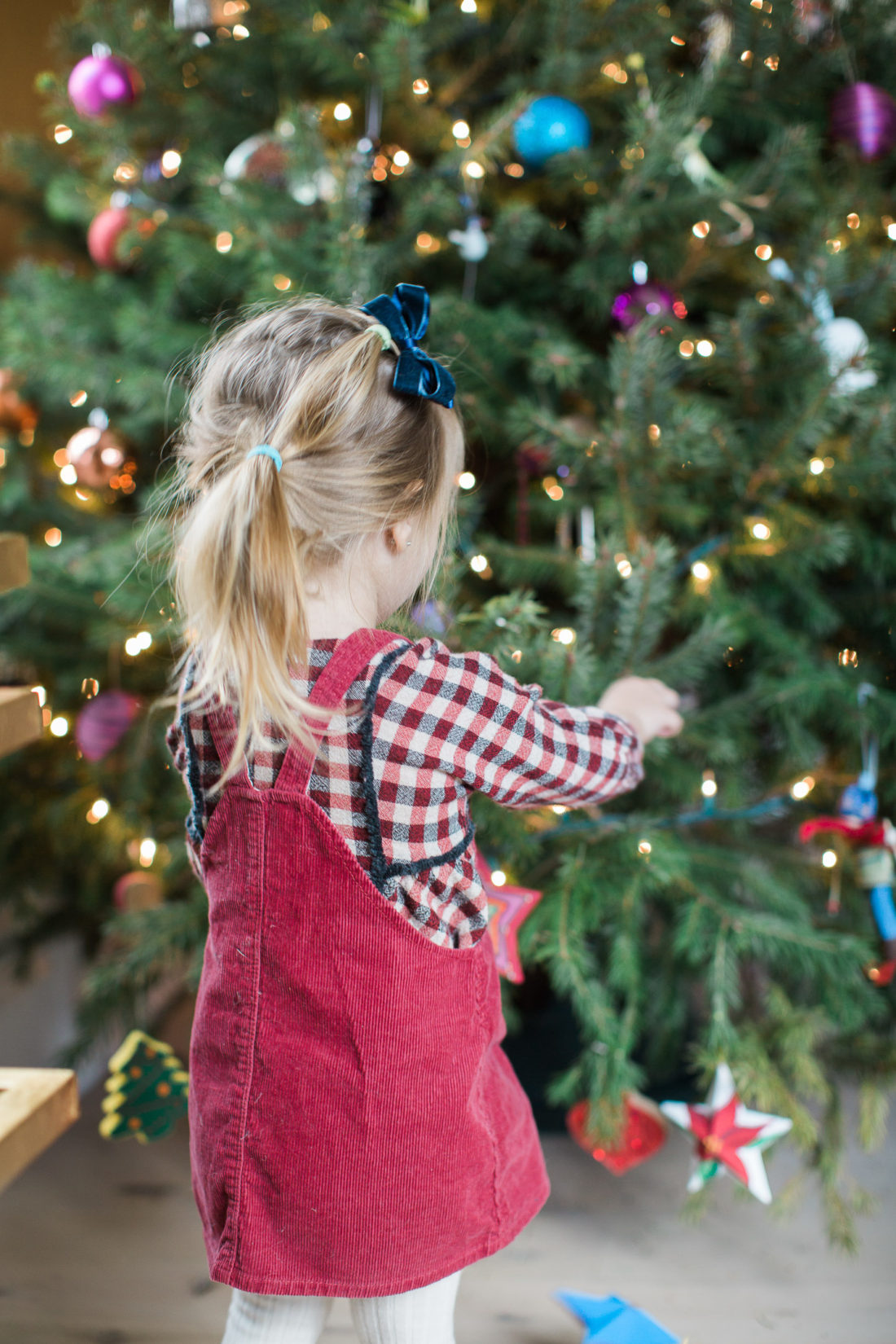 Marlowe Martino decorates the Christmas tree