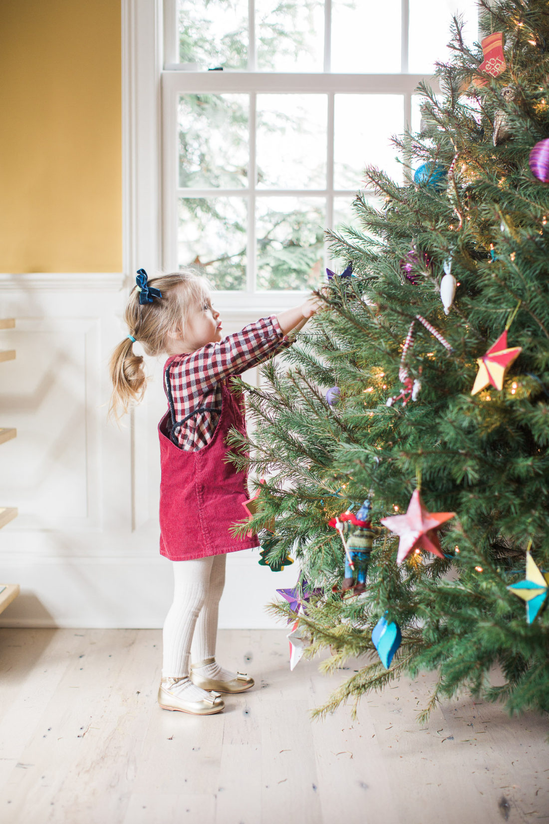 Marlowe Martino decorates the Christmas tree