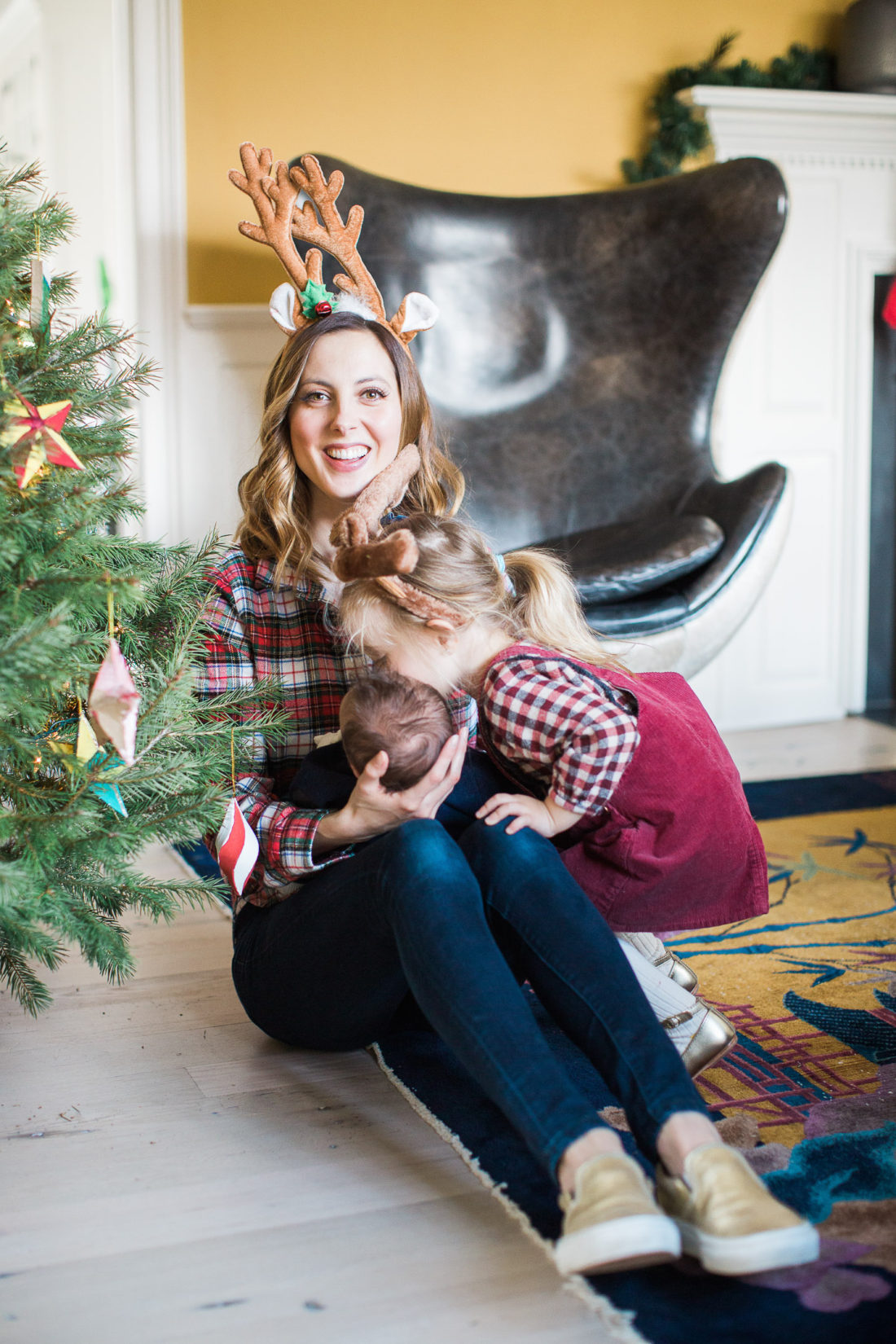 Eva Amurri Martino's toddler daughter Marlowe kisses her baby brother next to the Christmas tree