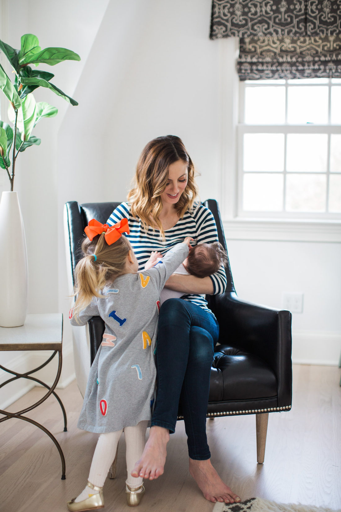 Eva Amurri Martino breastfeeds her newborn son, major, while daughter Marlowe looks on