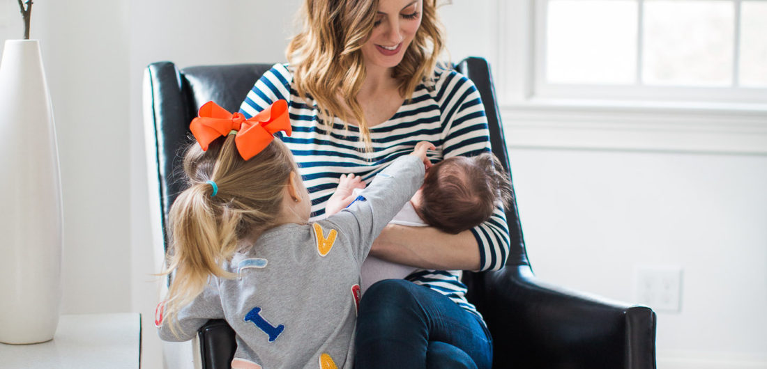 Eva Amurri Martino breastfeeds her newborn son, major, while daughter Marlowe looks on