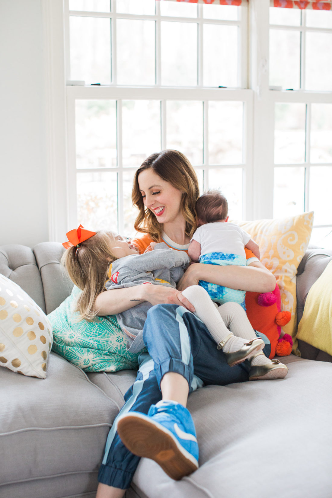 Eva Amurri Martino of lifestyle and motherhood blog Happily Eva After, embraces her two year old daughter Marlowe and her newborn son Major in their family home in connecticut