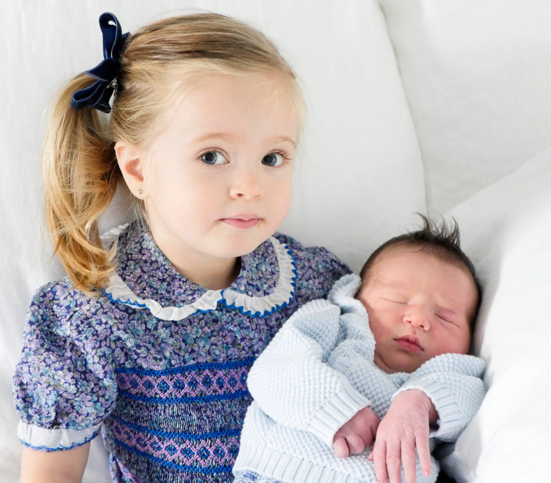 Marlowe Martino holds her days old baby brother Major James Martino