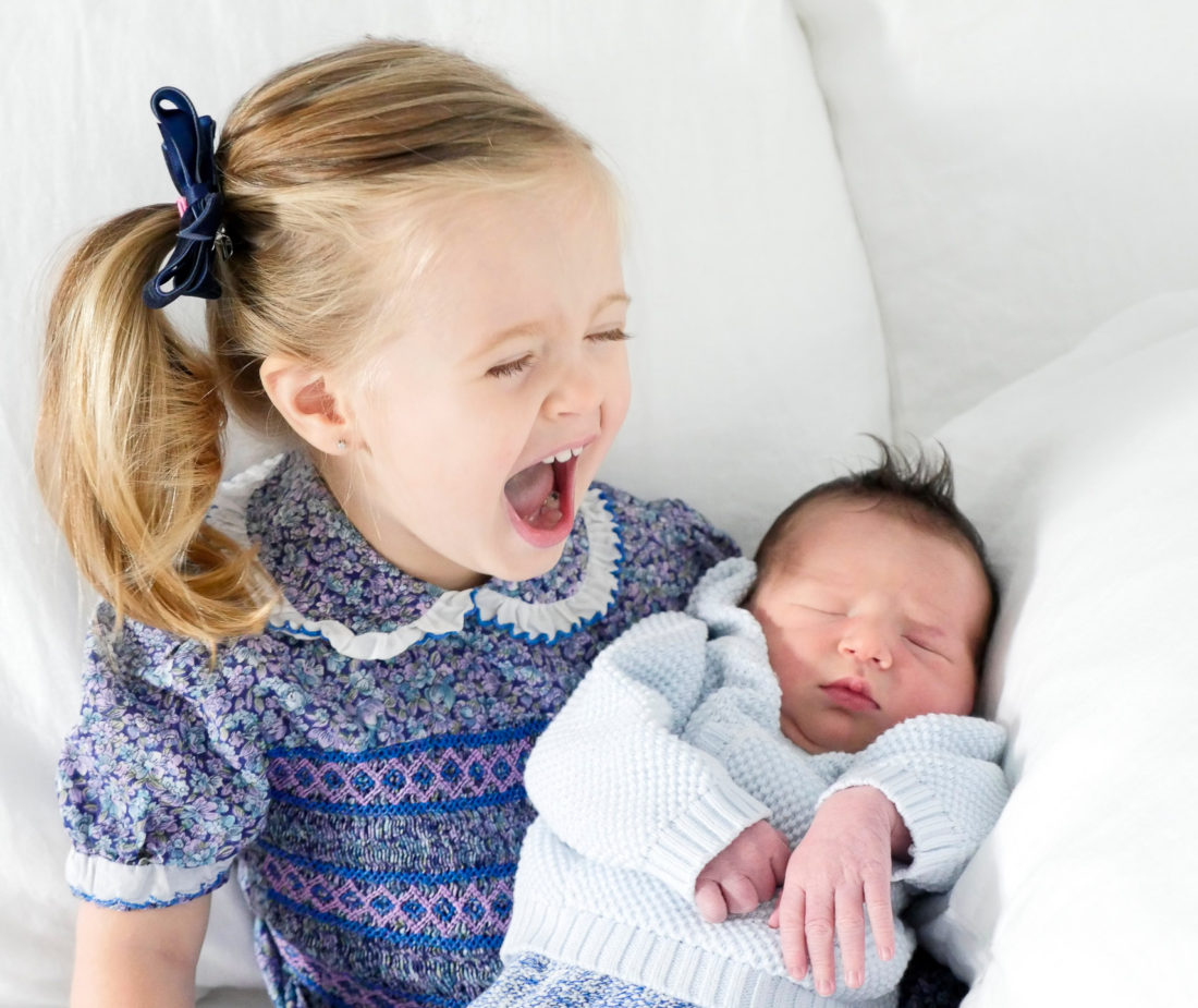 Marlowe Martino holds her days old baby brother Major James Martino