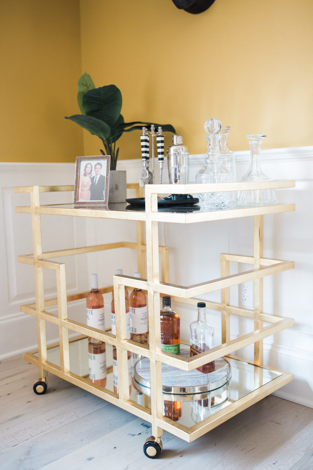 A deco gold bar cart in the living room of Eva Amurri Martino's home in connecticut