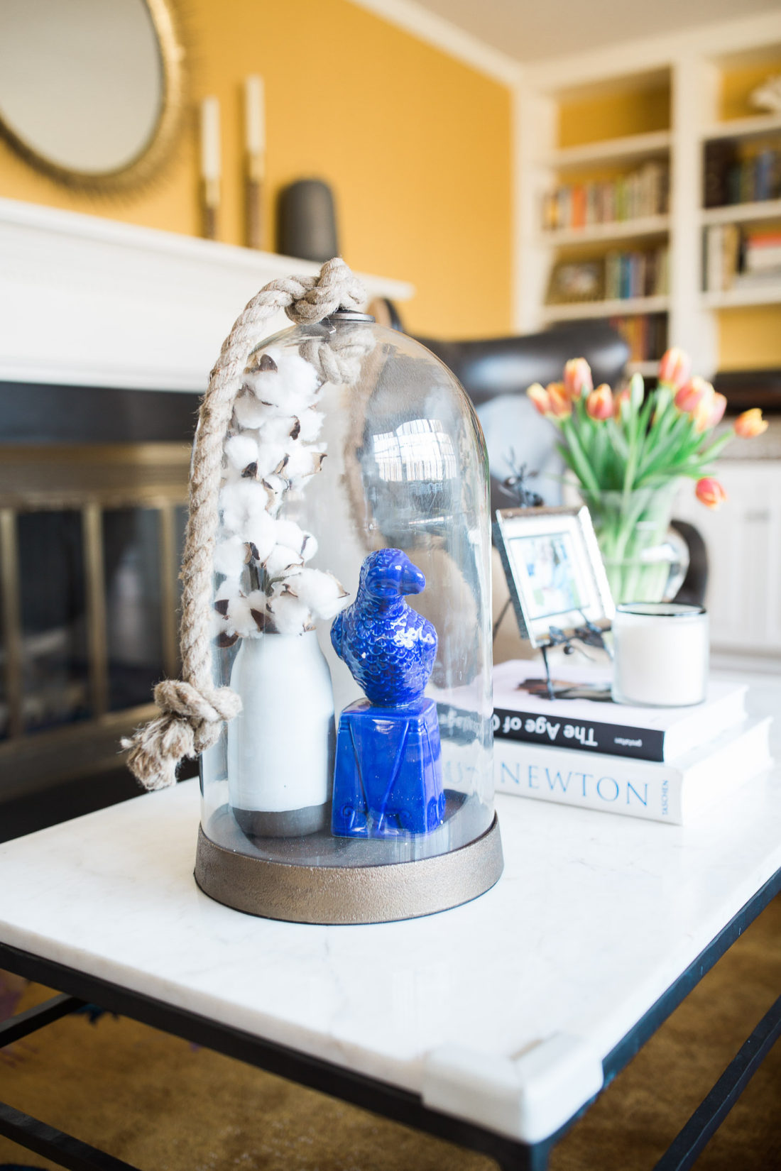 A large glass display cloche from Candelabra in the living room details of Eva Amurri Martino's Connecticut home