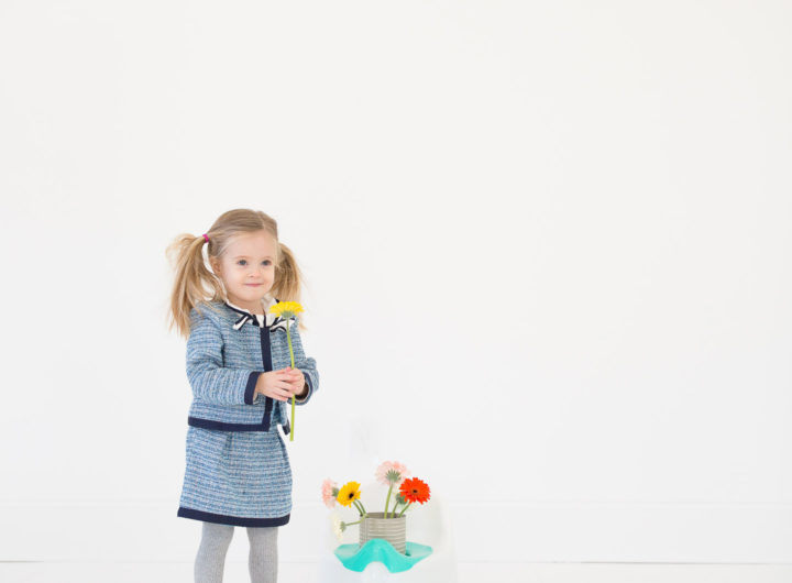 Marlowe Martino wears a tweed suit and pink kitty shoes and stands by her potty