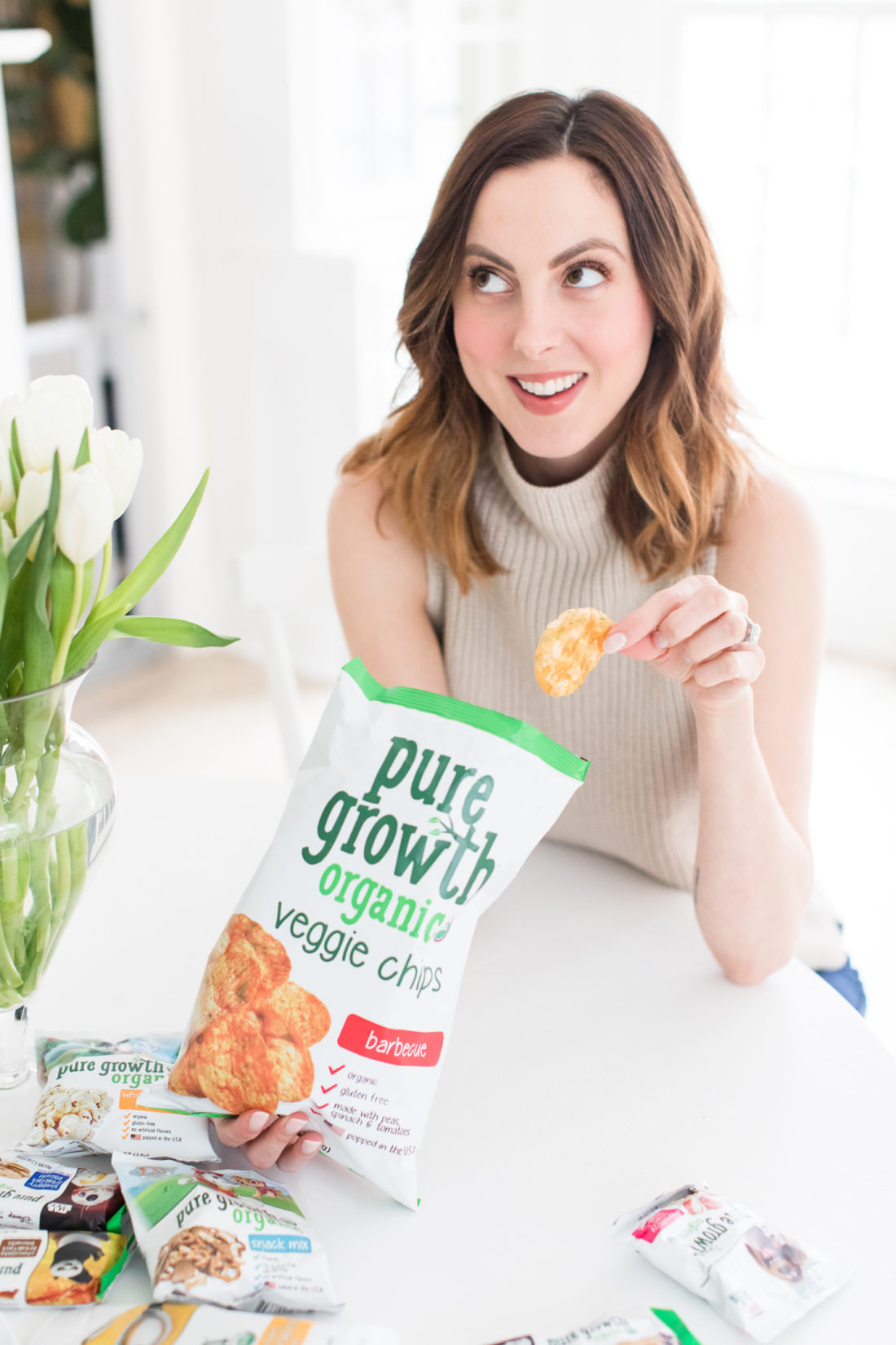 EVa Amurri Martino eats organic chips at her kitchen table in Connecticut