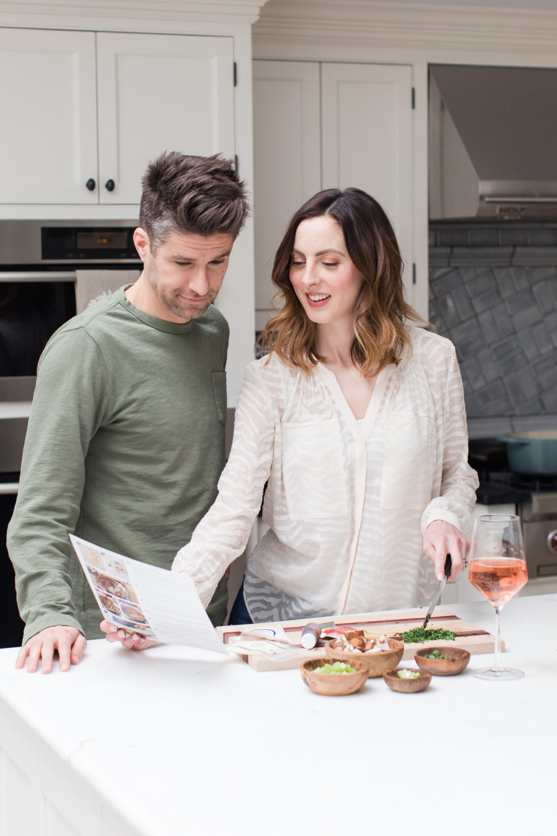 Eva Amurri Martino and Kyle Martino cook dinner together in the kitchen of their Connecticut home