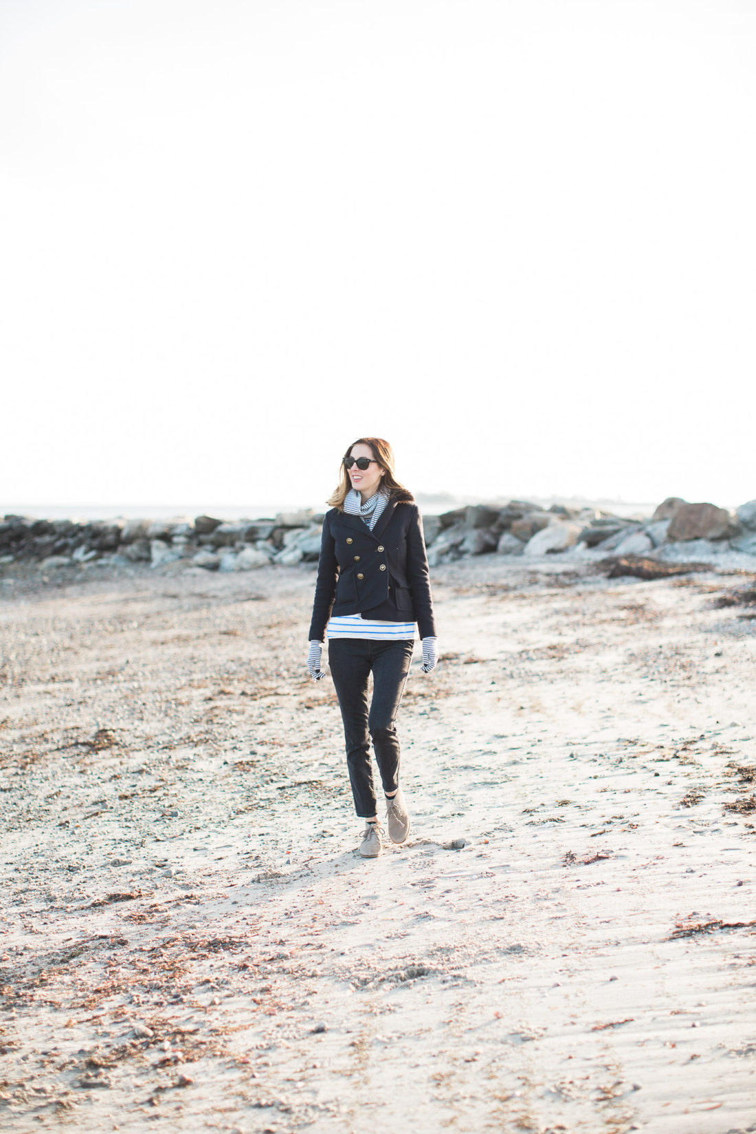 Eva Amurri Martino walks along the sand in the chilly weather at Compo Beach in Connecticut