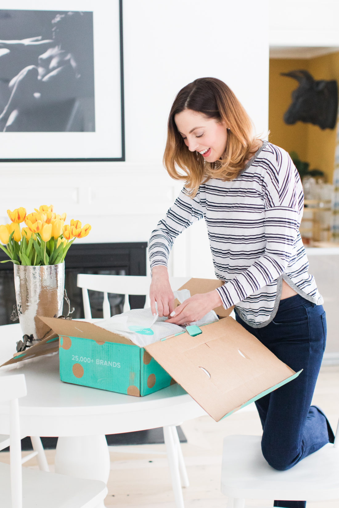 Eva Amurri Martino, of lifestyle and motherhood blog Happily Eva After, unpacks her thredUP delivery box