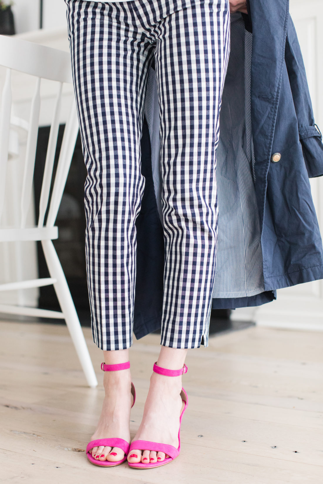 Blue and white gingham pants, hot pinks heels, and a navy trench are all part of a secondhand outfit of clothes put together by Eva Amurri Martino from thredUP