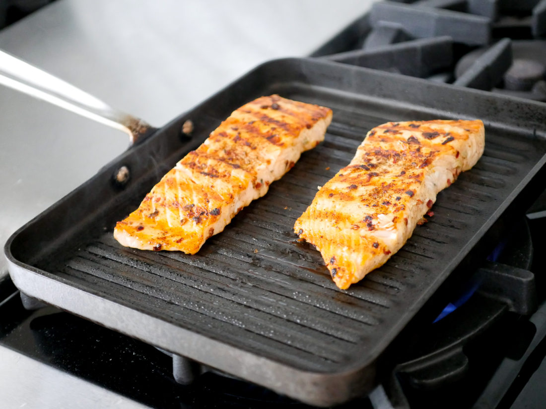 Mexican Spice-Rubbed Salmon cooks on a grill pan