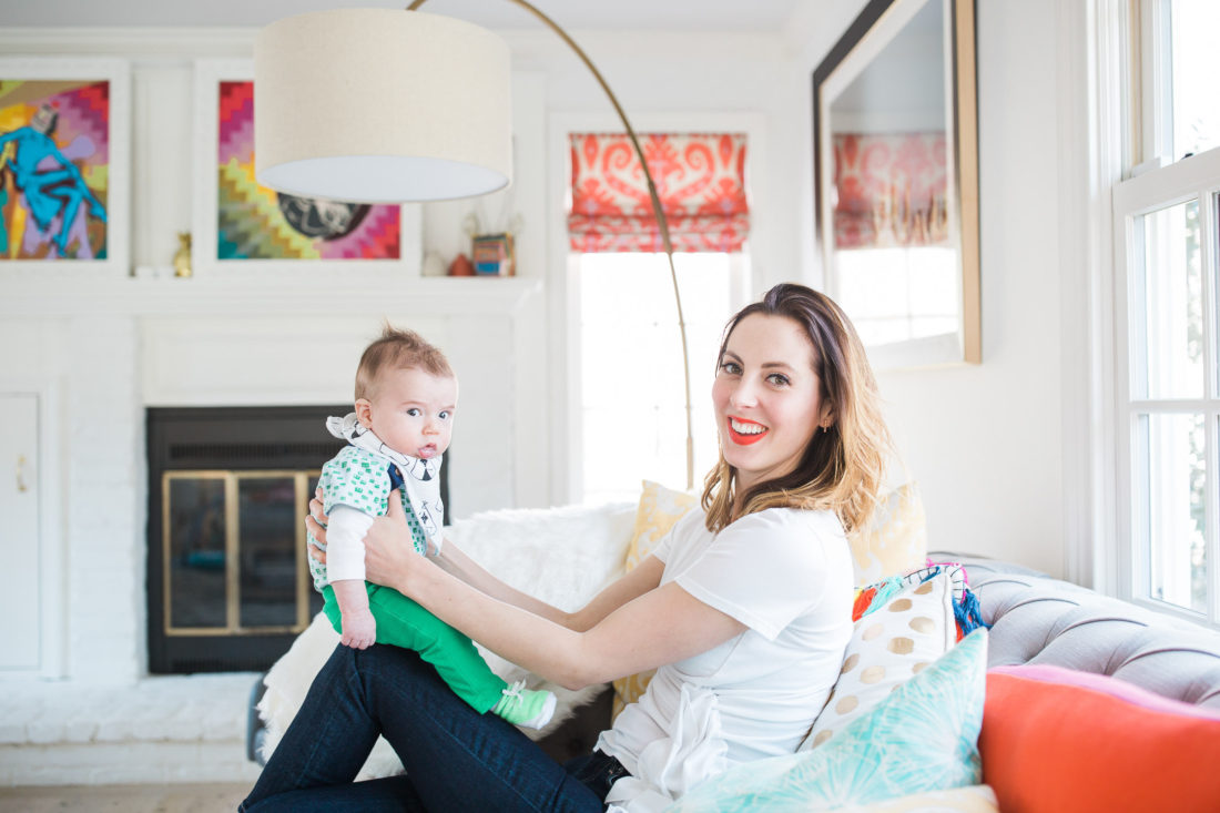Eva Amurri Martino holds her infant son Major in the colorful Family room of her Connecticut home